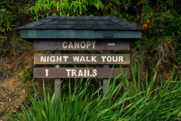 Sign indicating directions for canopy, night walk tour and trails, Monteverde, Puntarenas province, Costa Rica