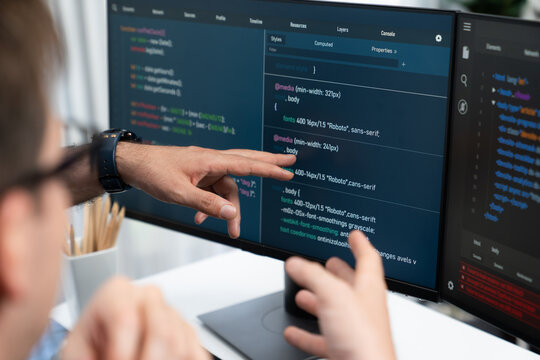 IT developers creating online software development information on screen laptop with coding program in data of application and website. Technical engineer coder on safety program concept. Sellable.