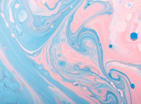 Abstract background with pink and blue swirls of liquid paint. Pastel colored fluid art paint.