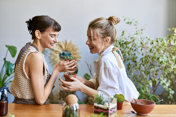 A tender moment shared between an arty lesbian couple in an art studio.