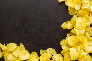 Set of homemade low calorie crispy potato chips in bowl, top view