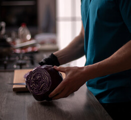 Professional cook in the kitchen - closeup shot