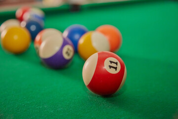 Multicolored balls on billiard table for playing 