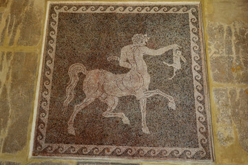 Rhodes, Greece - August 10, 2017: Mosaic of a centaur with a rabbit in the Museum of Rhodes, Greece. - obrazy, fototapety, plakaty