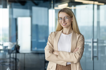 Confident businesswoman posing in modern office setting