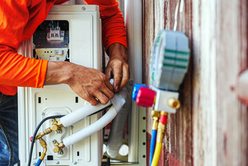Air conditioning technicians install new compressor air in homes, Repairman fix air conditioning...