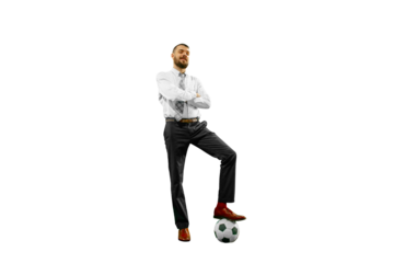 Confident young businessman in formal attire standing with soccer ball isolated on transparent background. Concept of human emotions, sport, hobby, leisure activity, business