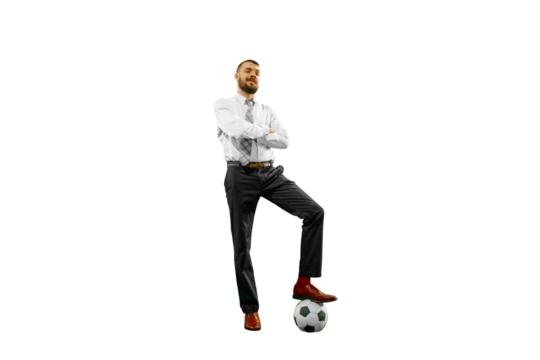 Confident young businessman in formal attire standing with soccer ball isolated on transparent background. Concept of human emotions, sport, hobby, leisure activity, business