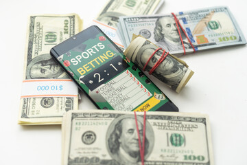 tablet pc with app for sport bets, on top of stacks of banknotes, white background, concept of online bets 3d render