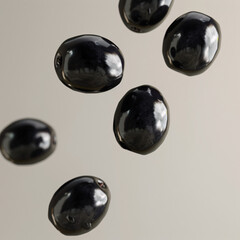 six shiny black olives floating against a light background.