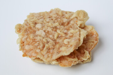 Keripik tempe or tempeh crackers, square shape. Thin slices tempeh, fried with flour dough. Isolated in white background