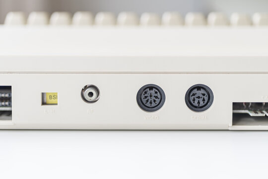 Rear view of vintage retro computer ports, including L-H port, serial port, and video port.