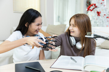 Happy two girl teen smile with braces students education stem hand robot model study in classroom....