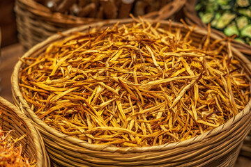 Dried Golden Marigold Flowers in Wicker Basket