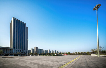 Wide Open Urban Space with Modern Buildings Against Blue Sky