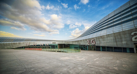 Contemporary Exhibition Center Facade with Dramatic Evening Sky