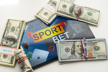 tablet pc with app for sport bets, on top of stacks of banknotes, white background, concept of online bets 3d render