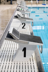 numbered platform for diving into the pool