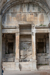 Fototapeta na wymiar Nîmes, France - 04 17 2024: The Gardens of The Fountain. View of the Temple of Diana.