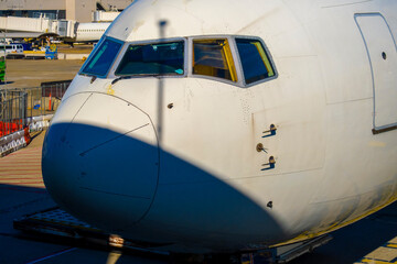 Fototapeta na wymiar Front view of generic commercial aircraft cockpit nose