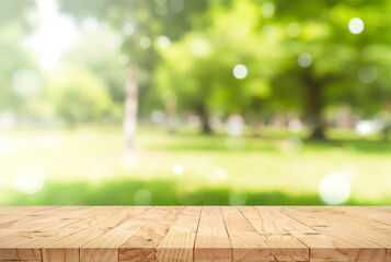 Nature background, Wood table for food and product display over blur green tree garden, Blur park...