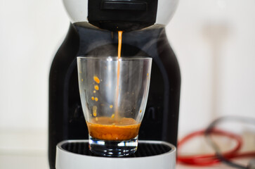 Espresso coffee from a machine delivers a bold, rich flavor with a velvety crema. Brewed under pressure, it offers an intense and aromatic experience, awakening the senses with its deep, complex taste