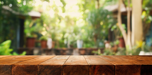 Wooden board empty table background. defocussed sunny room interior