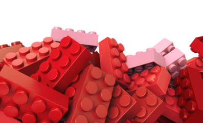 pink and red toy plastic bricks in a transparent background