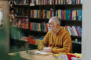 Knowledge Gazer Front View of Senior Man Amid Library Stacks
