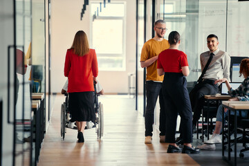 A dynamic group of young entrepreneurs engages in vibrant discussion within a modern glass office space, exploring new business projects and fostering innovation