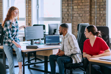 A diverse group of young business individuals congregates in a modern startup coworking center, embodying collaborative innovation and a dynamic atmosphere