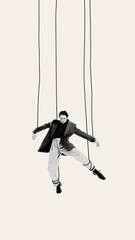 Young man hanging on strings symbolizing social and inner fears manipulation. Contemporary art...