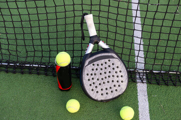 Paddle tennis objects on grass court