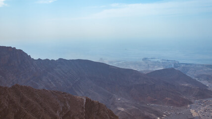 Jebel jais mountain, Majestic Rocky Mountains Under Clear Blue Sky During a Sunny Day