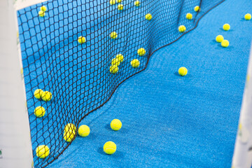 tennis padel balls in court 