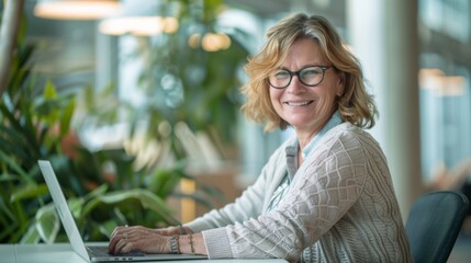 A Smiling Woman at Her Laptop