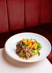 Gourmet steak with peppercorn sauce and fries