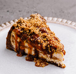 Delectable caramel cheesecake slice on plate