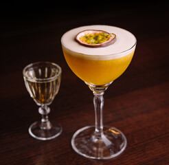 Elegant passion fruit cocktail with shot glass