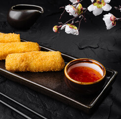 Crispy fried fish rolls with sweet chili sauce