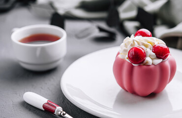 Elegant pink dessert with berries on plate