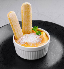Elegant creme brulee with savoiardi biscuits