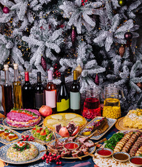 Festive holiday feast with decorated christmas tree