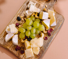 Gourmet cheese platter on wooden board