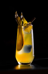 Chilled citrus cocktail on dark background