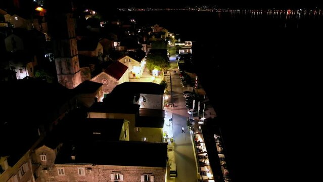 Aerial view of the architecture of the UNESCO-protected city of Perast at night, Montenegro