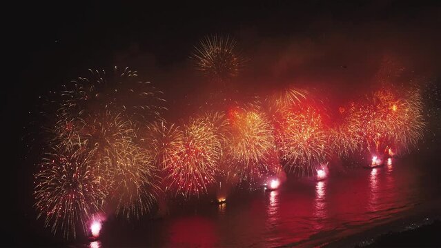Reveillon New Years fireworks in Copacabana, Zoom view from Sugar Loaf, Rio de Janeiro, Brazil.