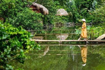 Woman by lake in Vietnam - 803138578