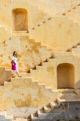 Woman at ancient stepwell in Jaipur - 803140545
