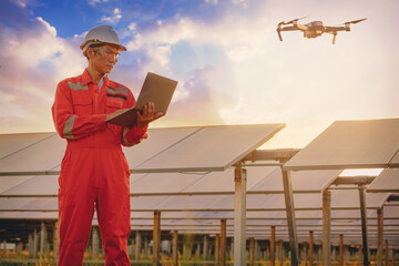 Silhouette of Electrical or instrument technician flying drone for temperature checking and...